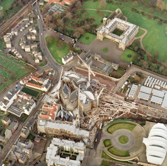 Oblique aerial view centred on the construction of the Scottish Parliament with exhibition centre and palace adjacent, taken from the SW.
