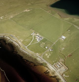 Oblique aerial view centred on the hotel with the remains of the rig adjacent, taken from the SSE.