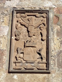 Detail of armorial panel over entrance.