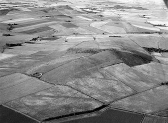 Oblique aerial view centred on the remains of the fort at Hill of Newleslie, looking to the ENE.