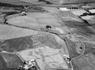 Oblique aerial view centred on cropmarks of geomorphological origin with the site of St Luke's Chapel and well at Clova adjacent, looking to the NW.