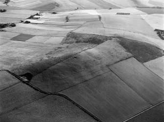 Oblique aerial view centred on the remains of the fort at Hill of Newleslie, looking to the ENE.