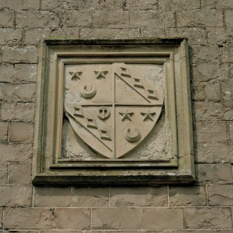 Detail of coat of arms on south face of main block.