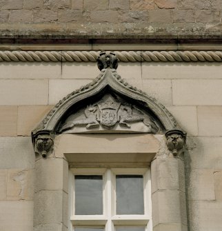 Detail of pediment above window on south front.
