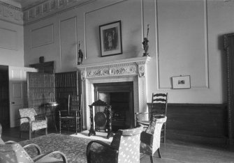 Interior view of Auchincruive House showing room with fireplace.