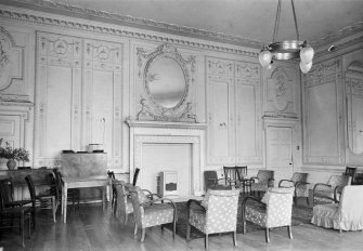 Interior view of Auchincruive House showing room with fireplace.