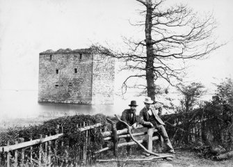 View of castle with men leaning on fence in foreground
Titled: 'Stanely Castle.'
Inscribed on verso: 'Residence of the Ross family, now in reservoir at Nethercraig.'
