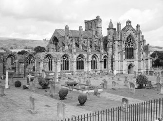 View of S transept across graveyard.