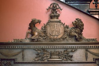 Detailed view of Royal Arms of Scotland at top of panel commemorating Queen Victoria's visit, within entrance hall of Royal Infirmary of Edinburgh.
