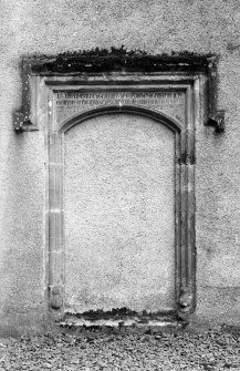 Detail of door with inscribed lintel.
