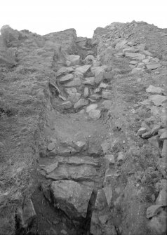 Woden Law, native fort and Roman investing works: excavation photograph.
I A Richmond: S section of Dark Age wall, looking N. Undated.
