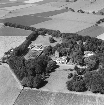 Affleck Castle and Home Farm, Monikie.  Oblique aerial photograph taken facing north.