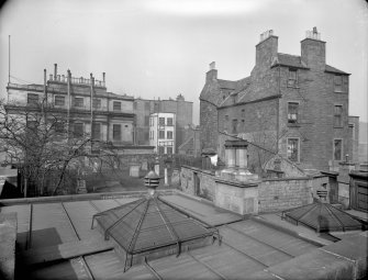 East elevation, showing part of calton Hill Burial Ground and old Tenement at 15 Calton Hill, Edinburgh.