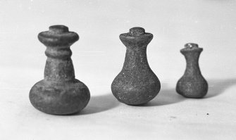 Three sizes of copper-alloy knobbed handles with unbeaten rivet studs at the base. These are presumably for lids to which they had not yet been attached