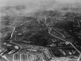 Provan Gas Works, Provan Road, Glasgow.  Oblique aerial photograph taken facing west.  This image has been produced from a print. 
