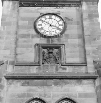 Tower, detail of clock and armorial panel below