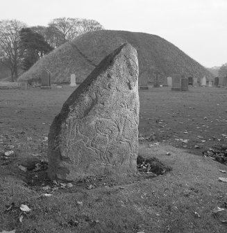 View of face of Inverurie no. 4 Pictish symbol stone and the Bass of Inverurie visible in the background.