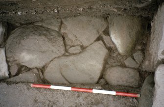Detail of paving at NE corner of the excavation trench. Scale in 200mm divisions