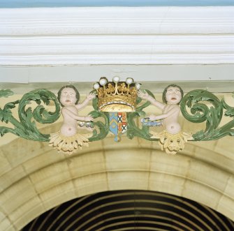 Interior.
Detail of carved coat of arms with figures above balcony in Hopetoun Loft.
