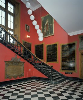 Entrance Lobby. View of staircase from north east, showing commorative plaques and portrait