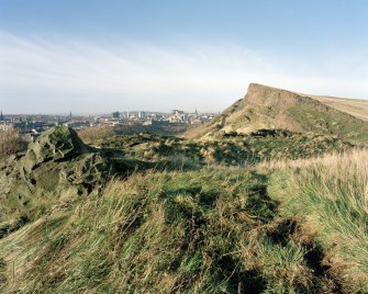 Holyrood Park: S end of Salisbury Crags, with city of Edinburgh behind
