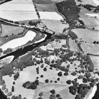 Oblique aerial view from SE, centred on the Abbey, dovecot, country house and Dryburgh House hotel.