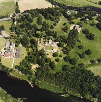 Dryburgh Abbey, oblique aerial view, taken from the W, centred on the abbey, with Dryburgh House Hotel on the left-hand side of the photograph.