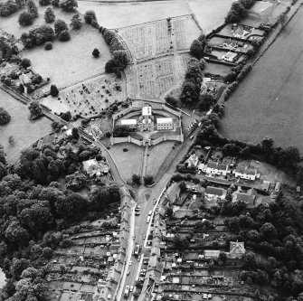 Oblique aerial view centred on the jail, burial ground and The Hermitage, taken from the NNE.