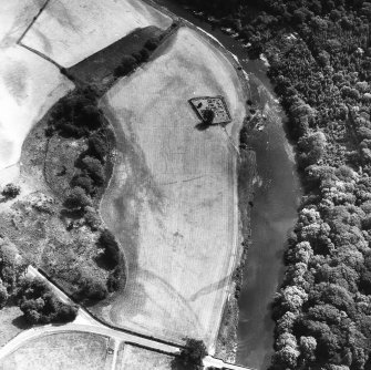 Oblique aerial view centred on burial ground from NW.