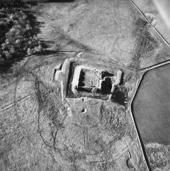Oblique aerial view centred on castle from E.