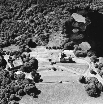 Oblique aerial view from SE, centred on the tower-house.