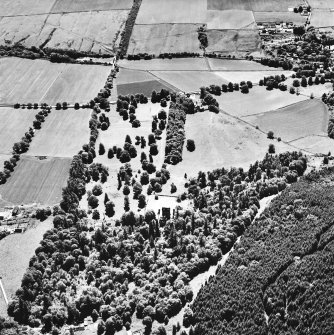 Castle Leod.
Oblique aerial view, taken from the NW, showing the tower-house and a possible golf course in the centre of the photograph.