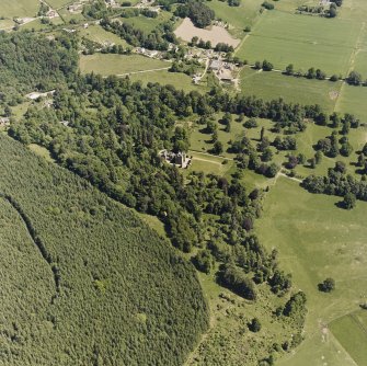 Castle Leod.
Oblique aerial view, taken from the SW, centred on the tower-house. A possible golf course is visible in the bottom right-hand corner of the photograph.
