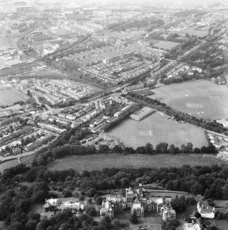 Oblique aerial view centred on Craig House, Old Craig House and Queen's Craig at bottom of photograph, and part of Craiglockhart area