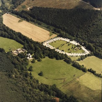 General oblique aerial view centred on the country house and caravan park, taken from the WNW.