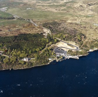Oblique aerial view centred on the country house, harbour and village, taken from the ESE.
