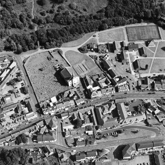 Oblique aerial view of Lesmahagow centred on the church and churchyard, taken from the WNW.