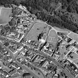 Oblique aerial view of Lesmahagow centred on the church and churchyard, taken from the WSW.