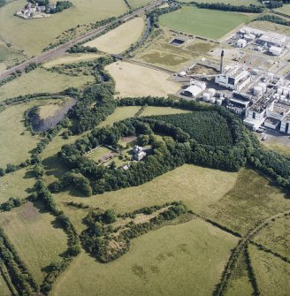 Oblique aerial view centred on the country house, with the chemical works adjacent, taken from the N.