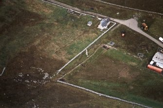 Oblique aerial view centred on the standing stone, taken from the ESE.