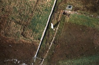 Oblique aerial view centred on the standing stone, taken from the SE.