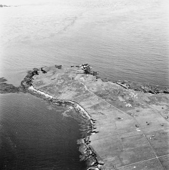 Stroma, oblique aerial view, taken from the ESE, centred on Mell Head and Uppertown township.
