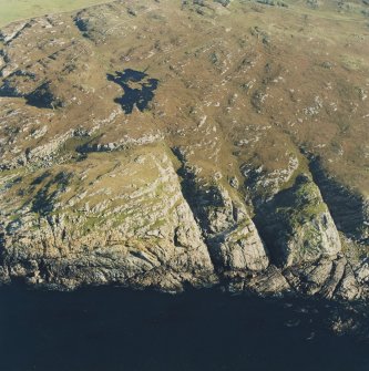 Oblique aerial view of Dun Dubh centred on the remains of a fort, taken from the NW.