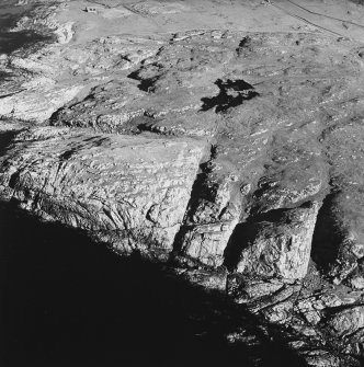 Oblique aerial view of Dun Dubh centred on the remains of a fort, taken from the W.