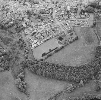 Oblique aerial view centred on the excavations of the Roman fort and possible annexe, taken from the SW.