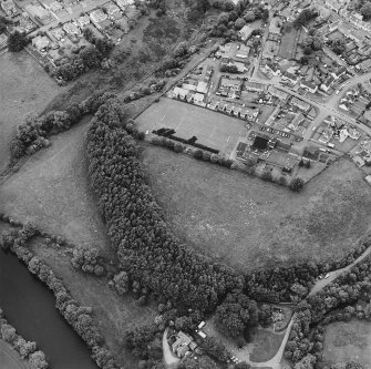 Oblique aerial view centred on the excavations of the Roman fort and possible annexe, taken from the SE.