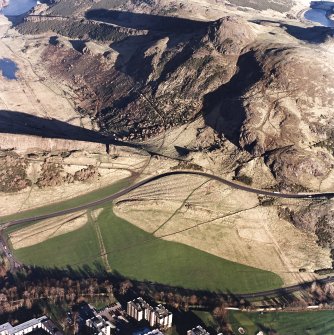 Oblique aerial view of Holyrood Park centred on the remains of cultivation with Arthur's Seat behind, taken from the SW.