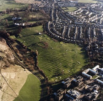 Oblique aerial view of Prestonfield centred on a golf course and rig, taken from the SSW.