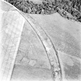 Caddonlee, oblique aerial view, taken from the WSW, centred on the cropmarks of an enclosure.