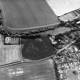 Preston Mill, oblique aerial view, taken from the N, centred on cropmarks including a possible settlement. Preston Mill is visible in the centre of the photograph.